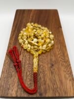 مسباح مستكه شبيه الكهرمان عسلي ملطخ