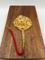 مسباح مستكه شبيه الكهرمان عسلي ملطخ